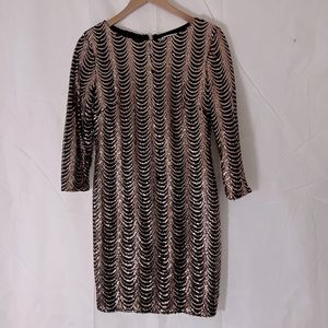 Gold and black, sequin patty dress, stretchy, perfect for a party.